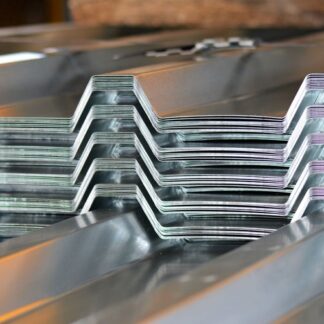 Stacked IBR roofing sheets showing the ribbed profile