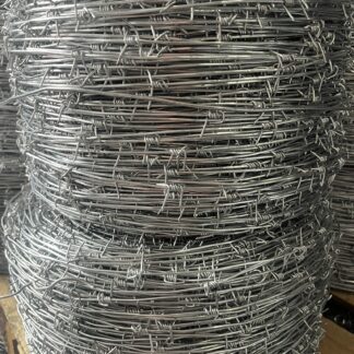 Coils of galvanized single-strand barbed wire