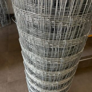 Close-up of galvanized field-fence roll with knotted wire intersections