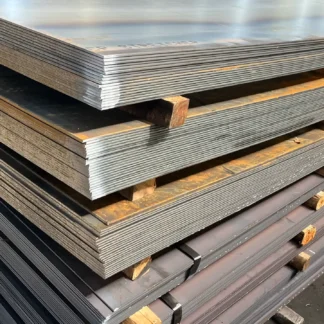 Stacks of hot-rolled mild steel sheets separated by wooden spacers